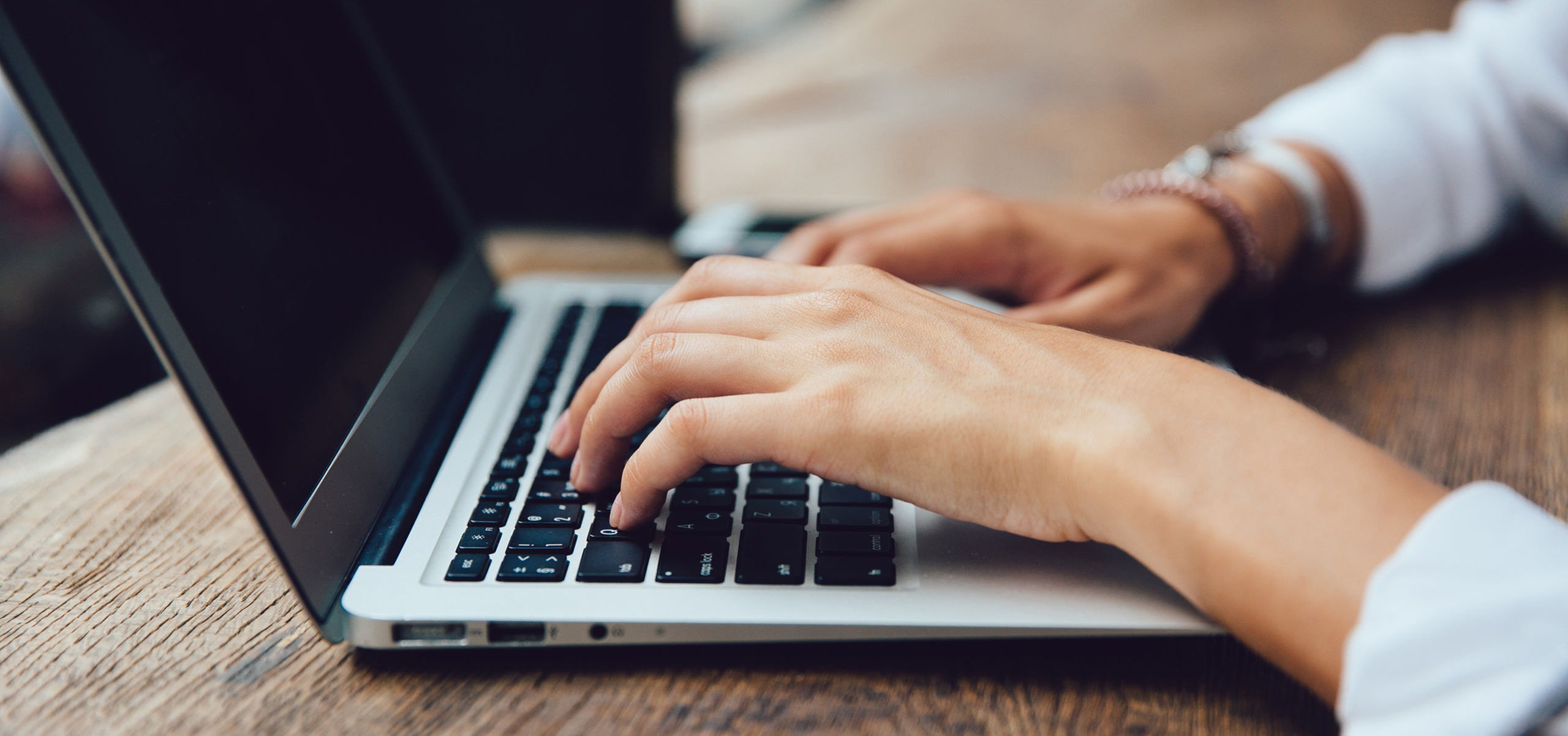 Hands typing keyboard