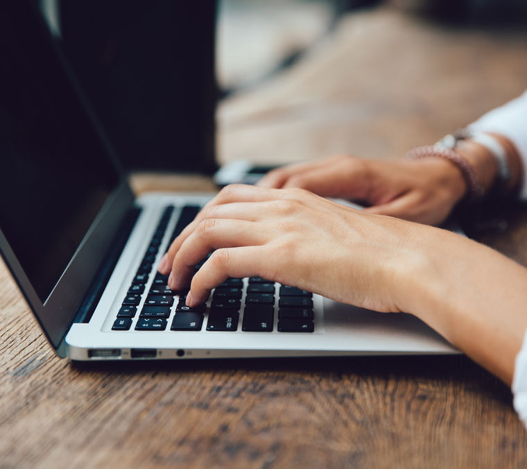 Hands typing keyboard