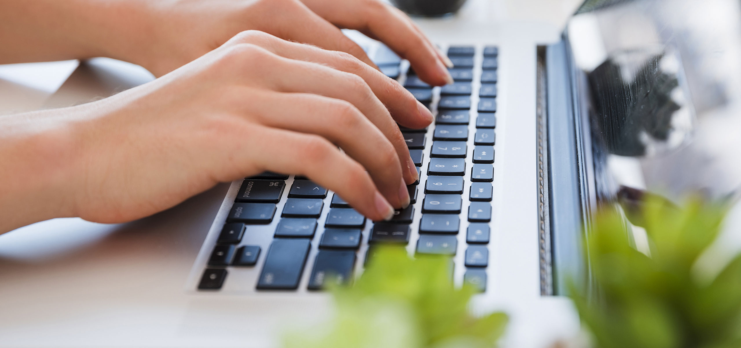 Close up hands typing keyboard