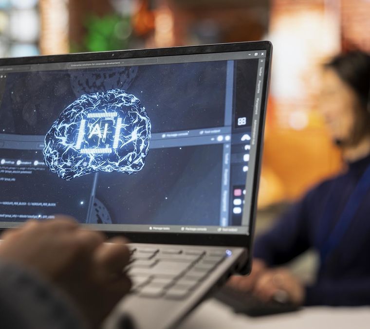 Call center worker using ai tech laptop reply customers closeup Cropped