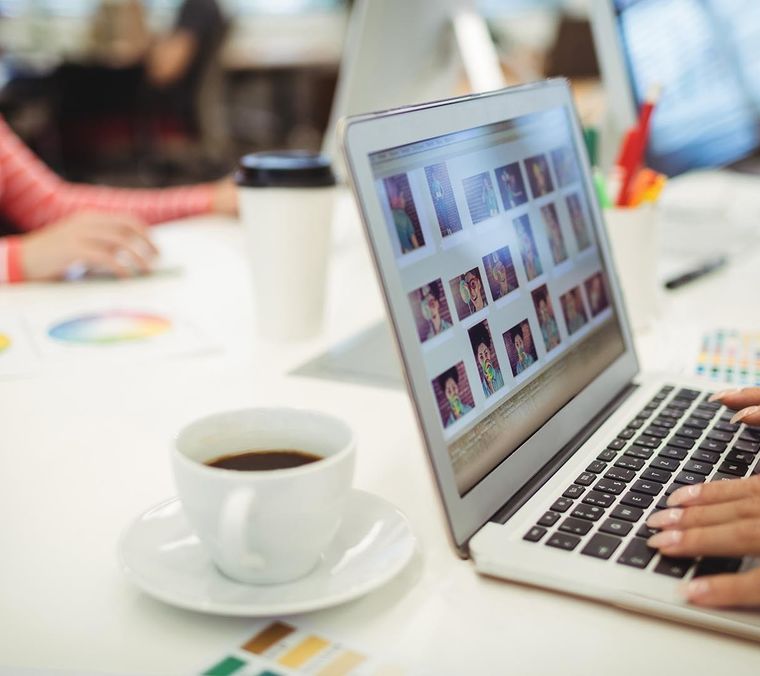 Graphic designers working their desk Cropped