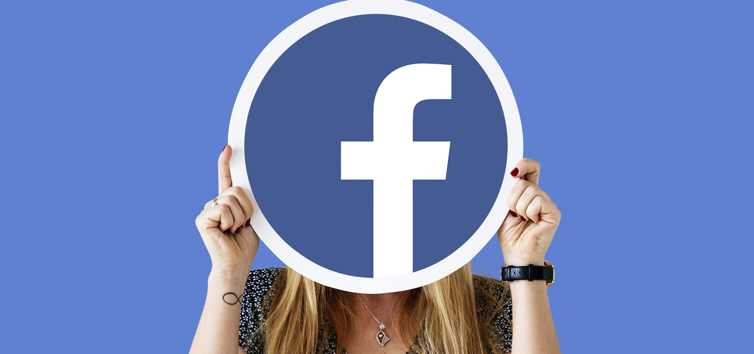 Woman showing facebook icon Cropped