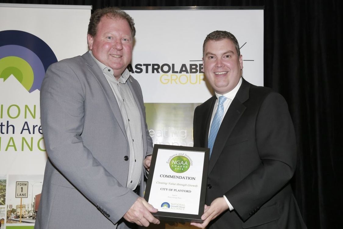 Phil Harrison, Advocacy Specialist and Mayor Glenn Docherty City of Playford receiving the 'Creating value through growth category' award from the NGAA.